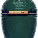 The Large Big Green Egg is a green, egg-shaped ceramic grill featuring a wooden handle and a temperature gauge on top.